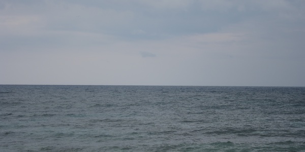 From the shoreline, no island is visible! From the shoreline, no island is visible!